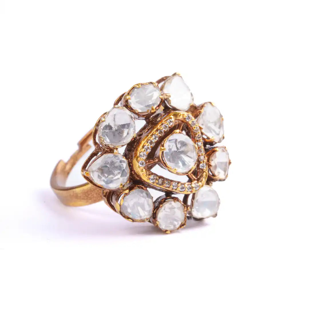 Elegant gold ring with clear gemstones in floral design, perfect for women's jewelry collection
