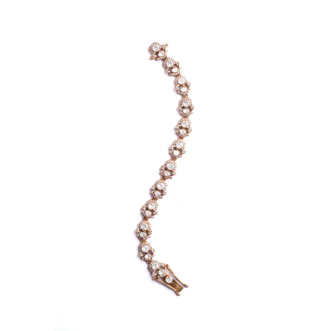 Elegant rose gold bracelet with sparkling diamond-like stones, perfect for women's fashion jewelry.
