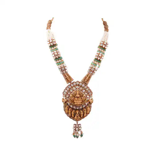 Elegant silver necklace with Ganesha pendant, green beads, and intricate craftsmanship for festive wear