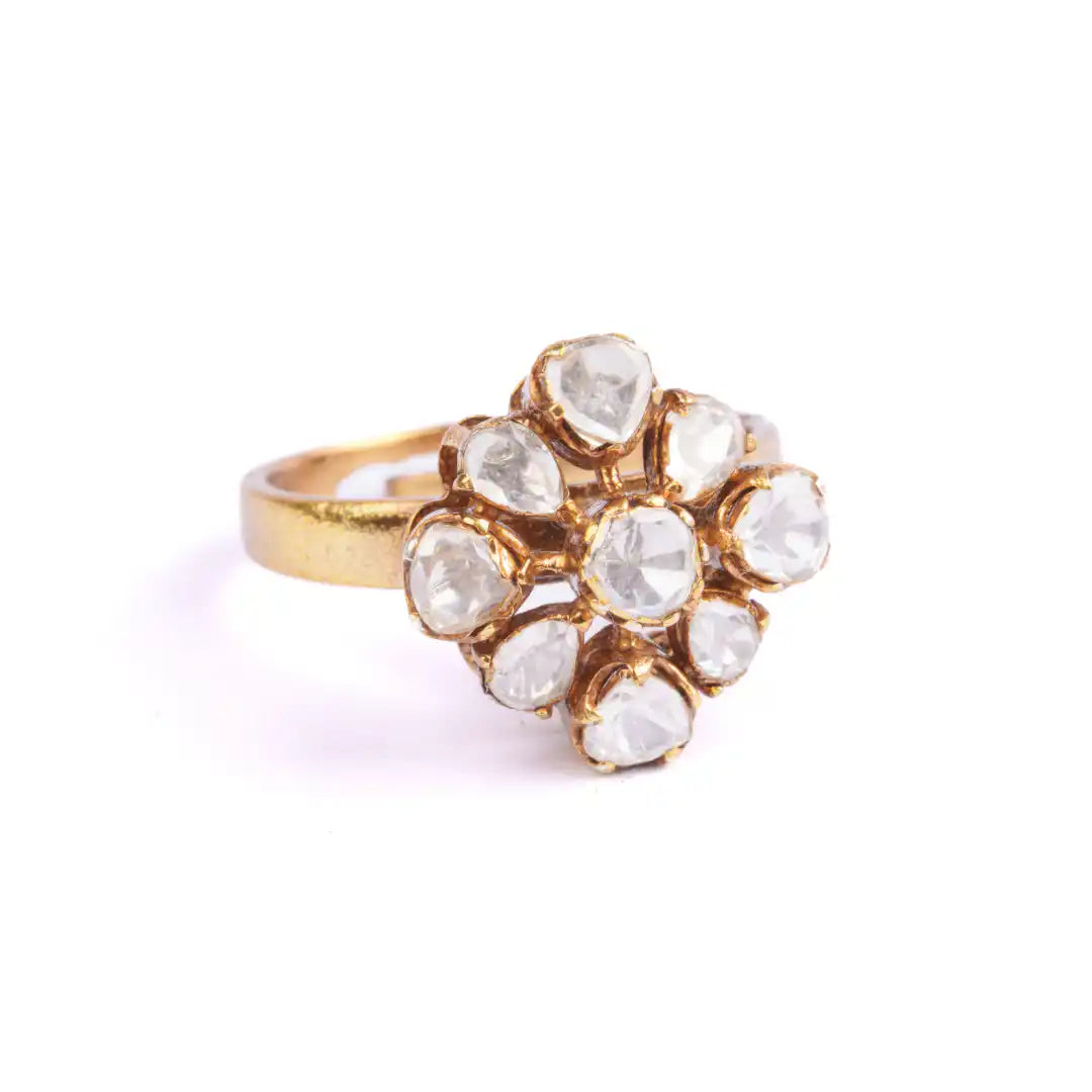 Elegant gold ring with sparkling clear gemstones in floral design