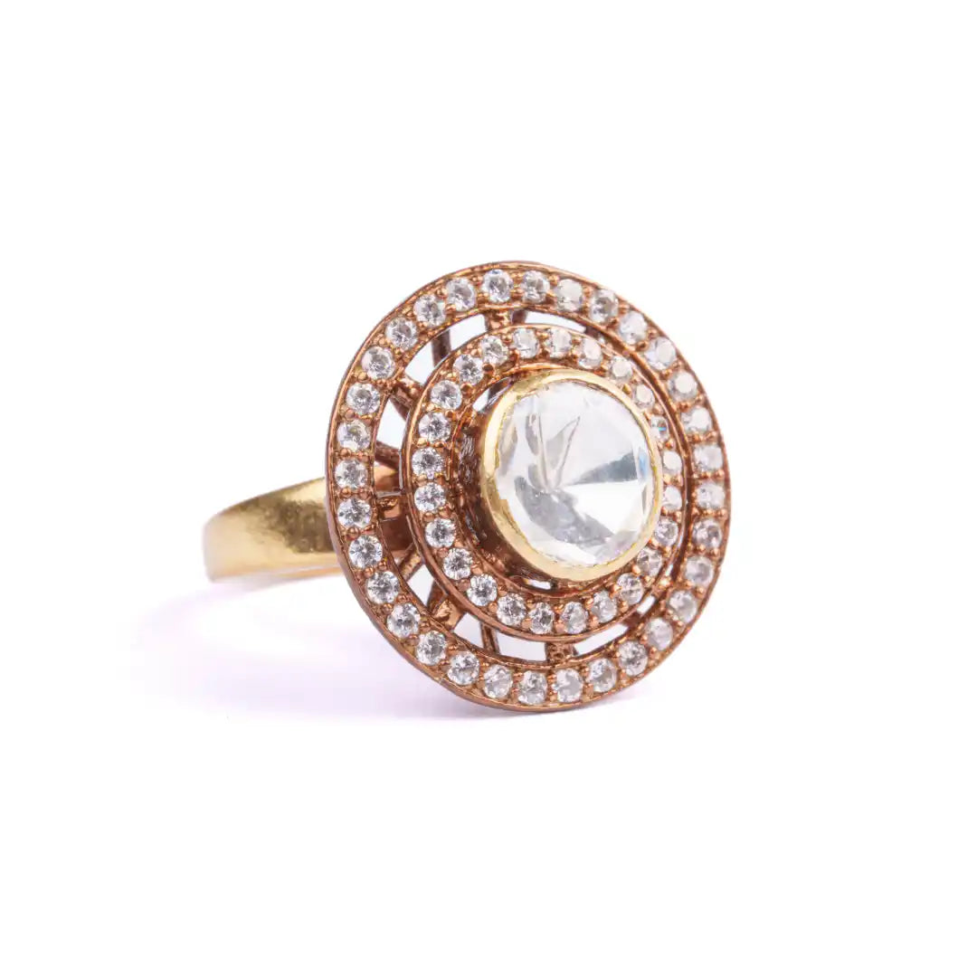 Elegant gold ring with central diamond and halo of smaller diamonds, vintage-inspired design