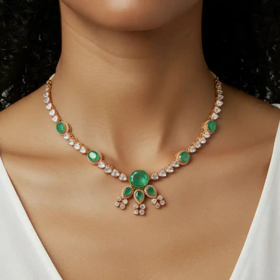 Elegant emerald and diamond necklace with intricate gold detailing