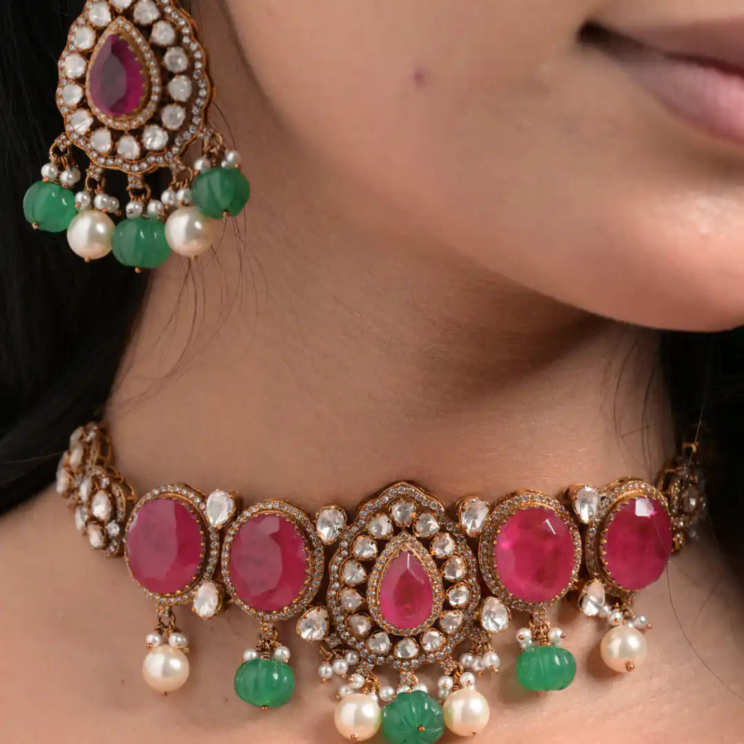 Elegant ruby and emerald choker necklace with pearl drops, perfect for traditional occasions.