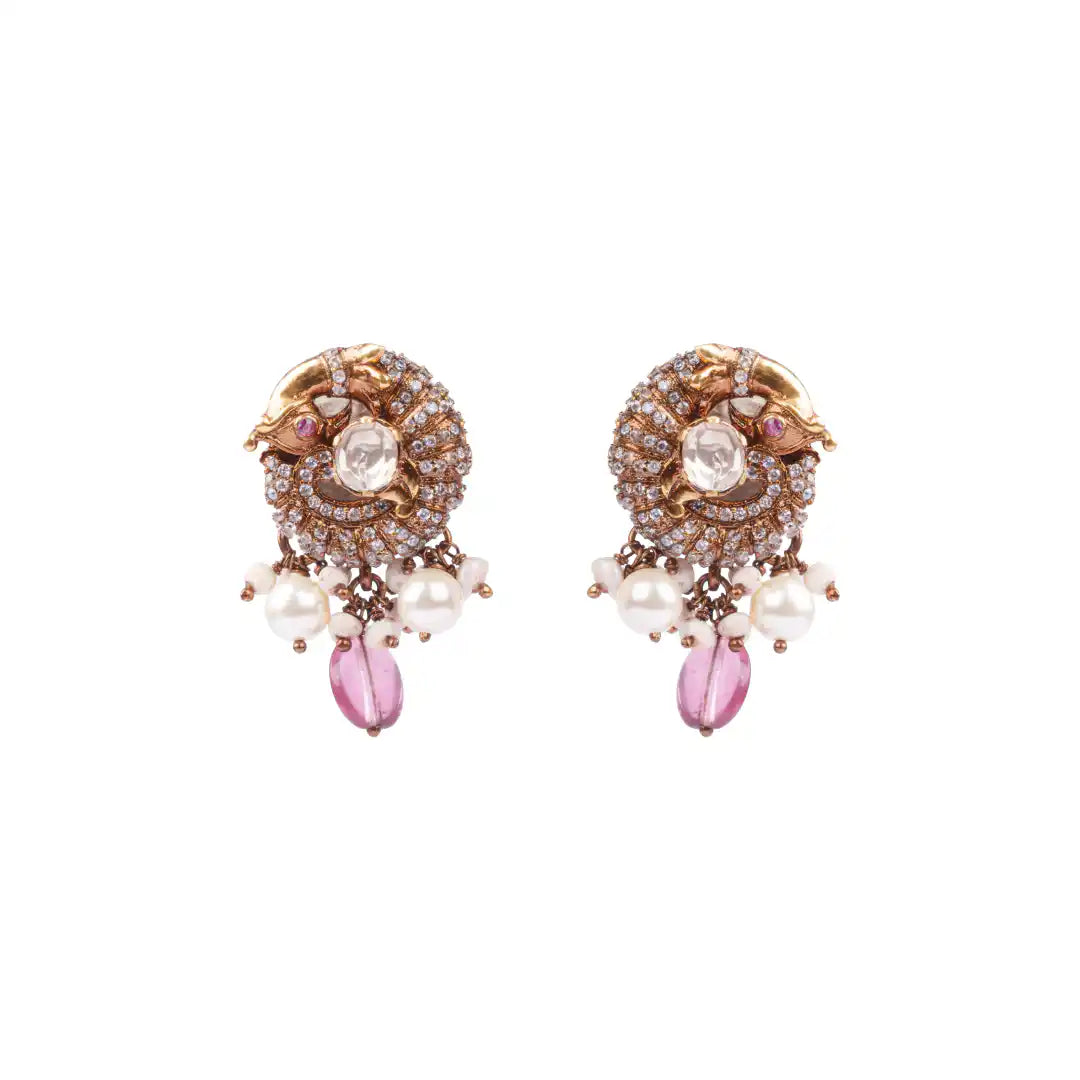 Elegant silver earrings with pearls, pink gemstones, and intricate detailing for festive wear