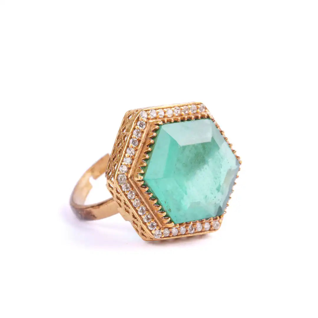 Hexagonal emerald ring with gold filigree and diamond accents, elegant statement jewelry