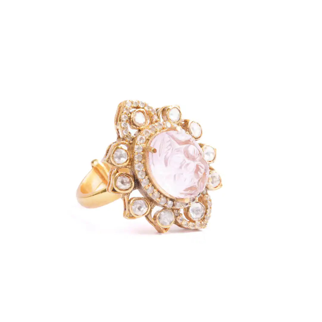 Elegant gold ring with pink gemstone and diamond accents, inspired by Ganesha's wisdom