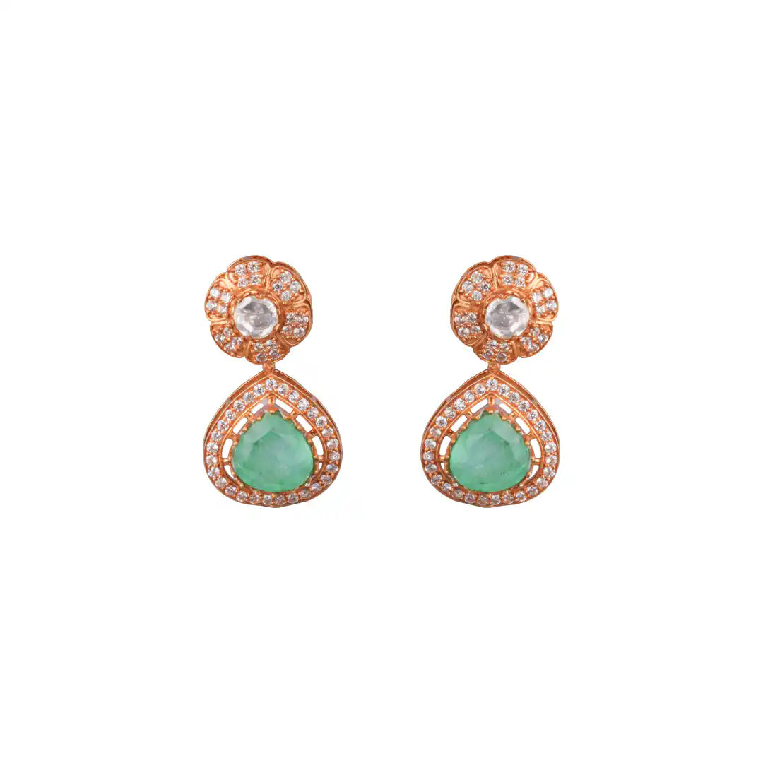 Rose gold earrings with emerald drops and diamond accents, elegant floral design