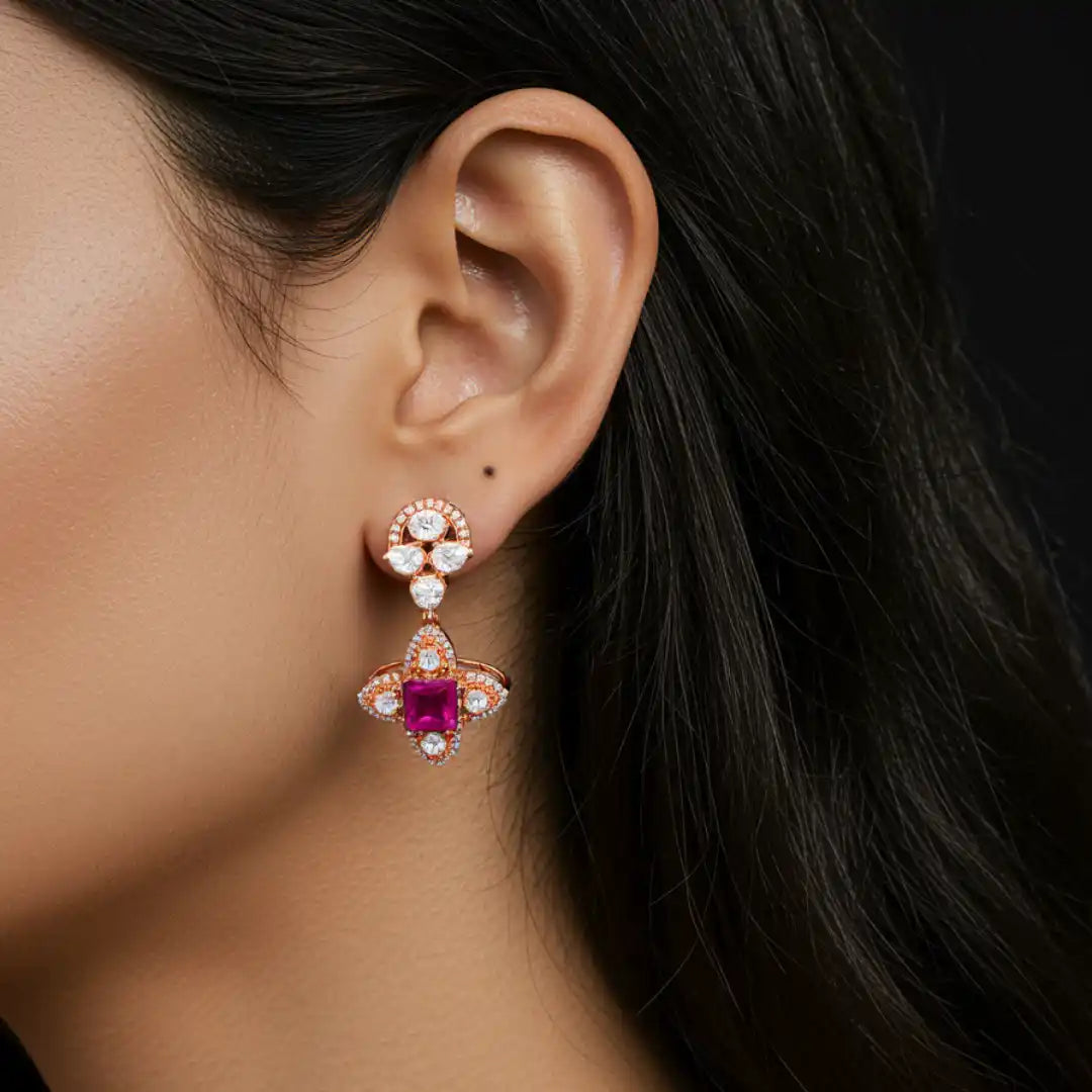 Elegant rose gold earring with pink gemstone and diamond accents, showcasing luxury jewelry design