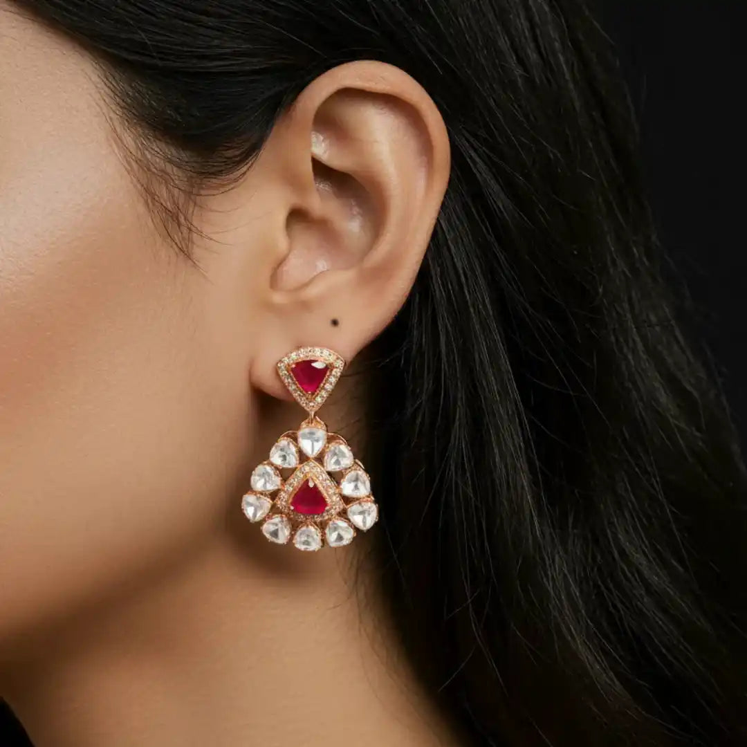 Elegant ruby and diamond drop earrings in rose gold, showcasing intricate Indian jewelry design.