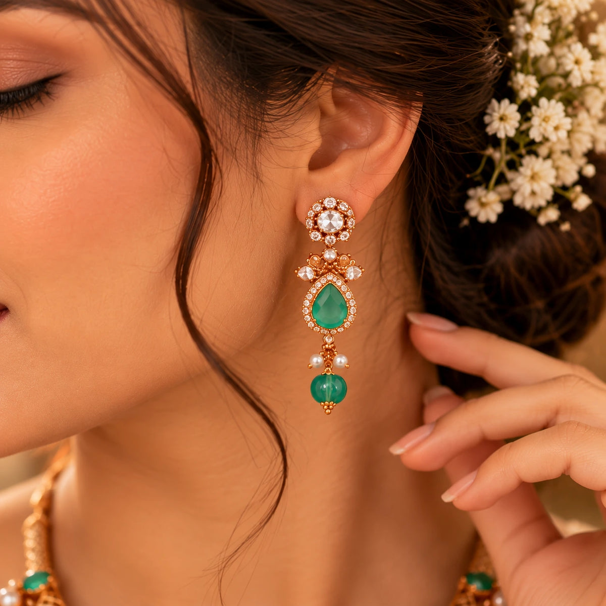 Elegant emerald green Gajaah 925 sterling silver bridal earrings featuring traditional design and intricate craftsmanship.