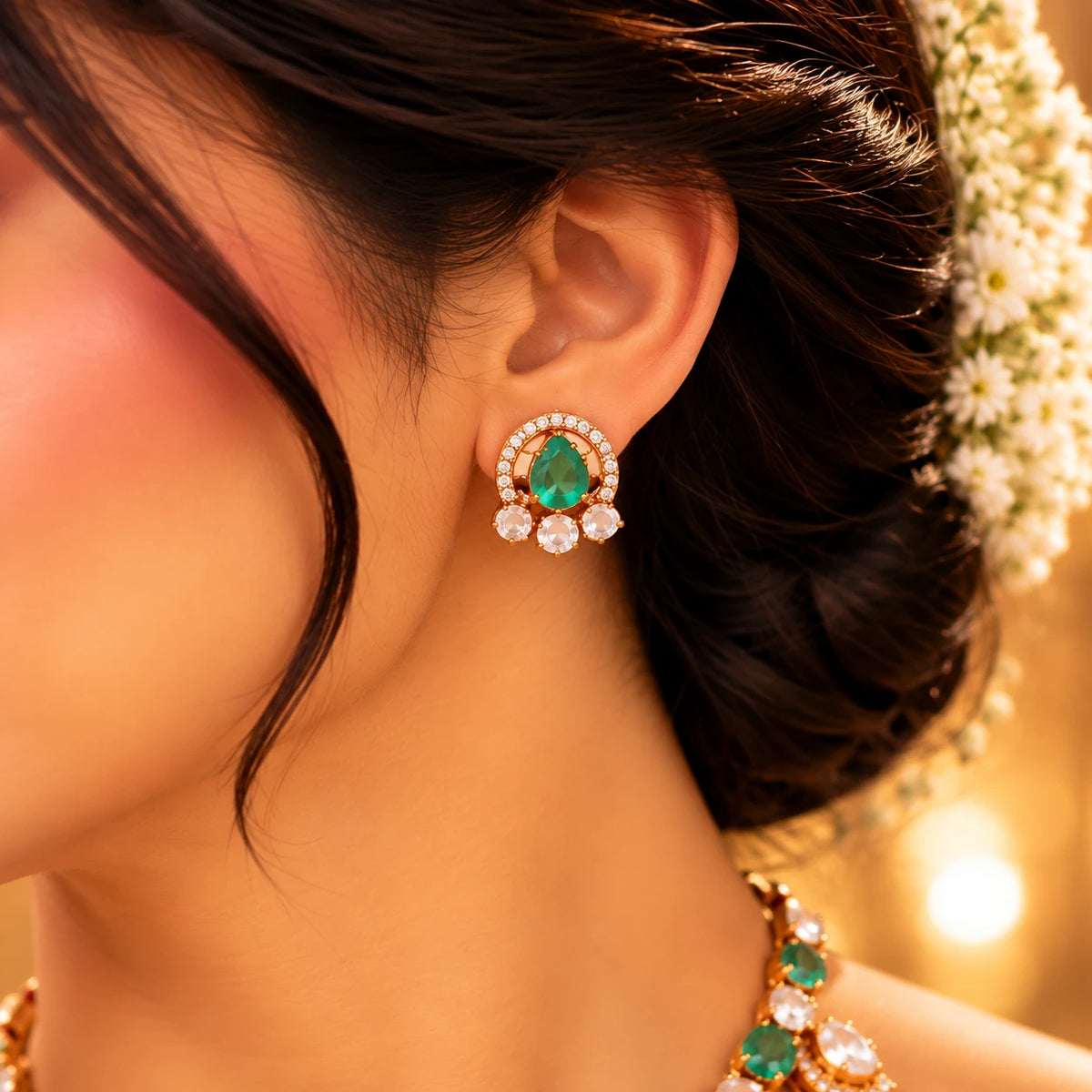 Gajaah 925 sterling silver emerald necklace and earrings set featuring intricate bridal jewelry with gold accents and vibrant emerald stones.